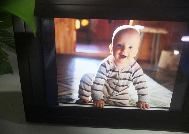 cute baby in  Hdgenius 10 inch wifi picture frame